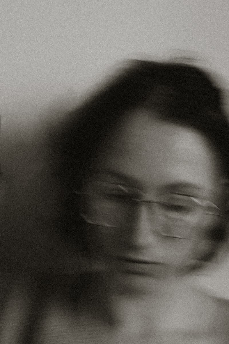 Alina Kabanets, a black-and-white self-portrait with motion blur